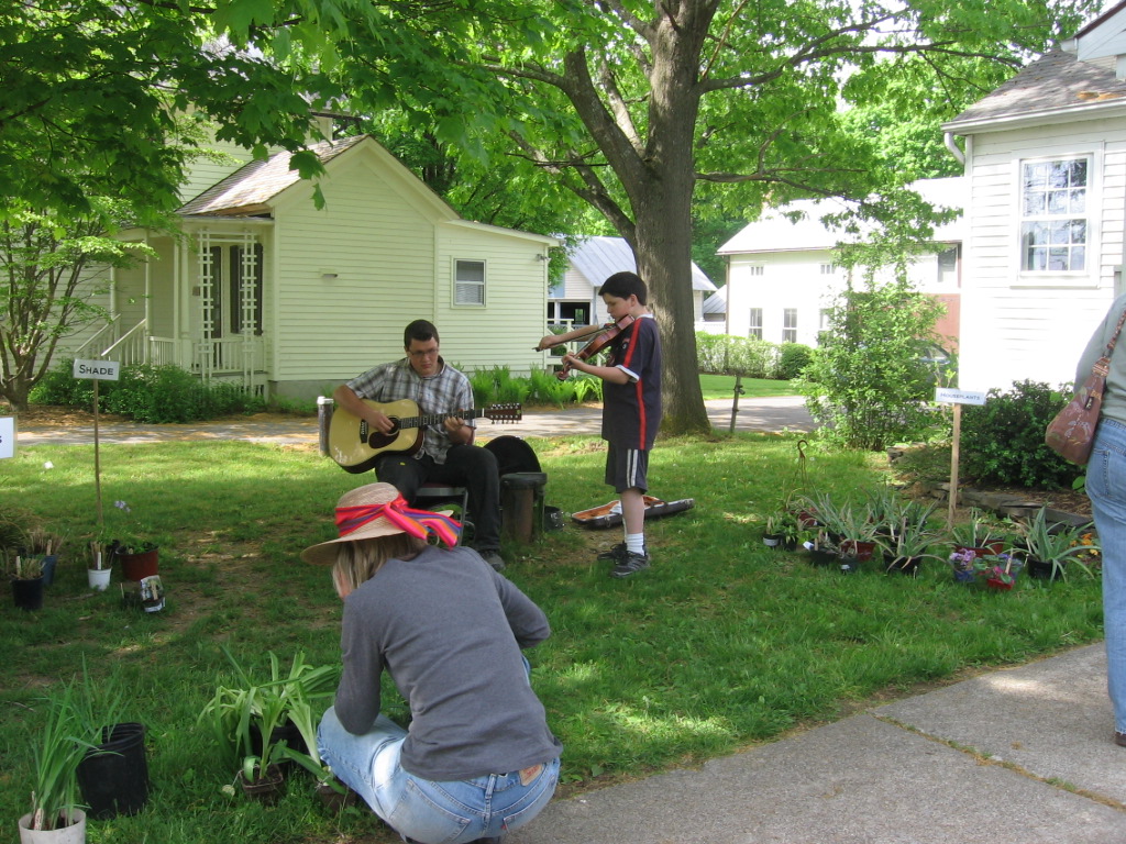 Two boys playing music at Books and Blooms
