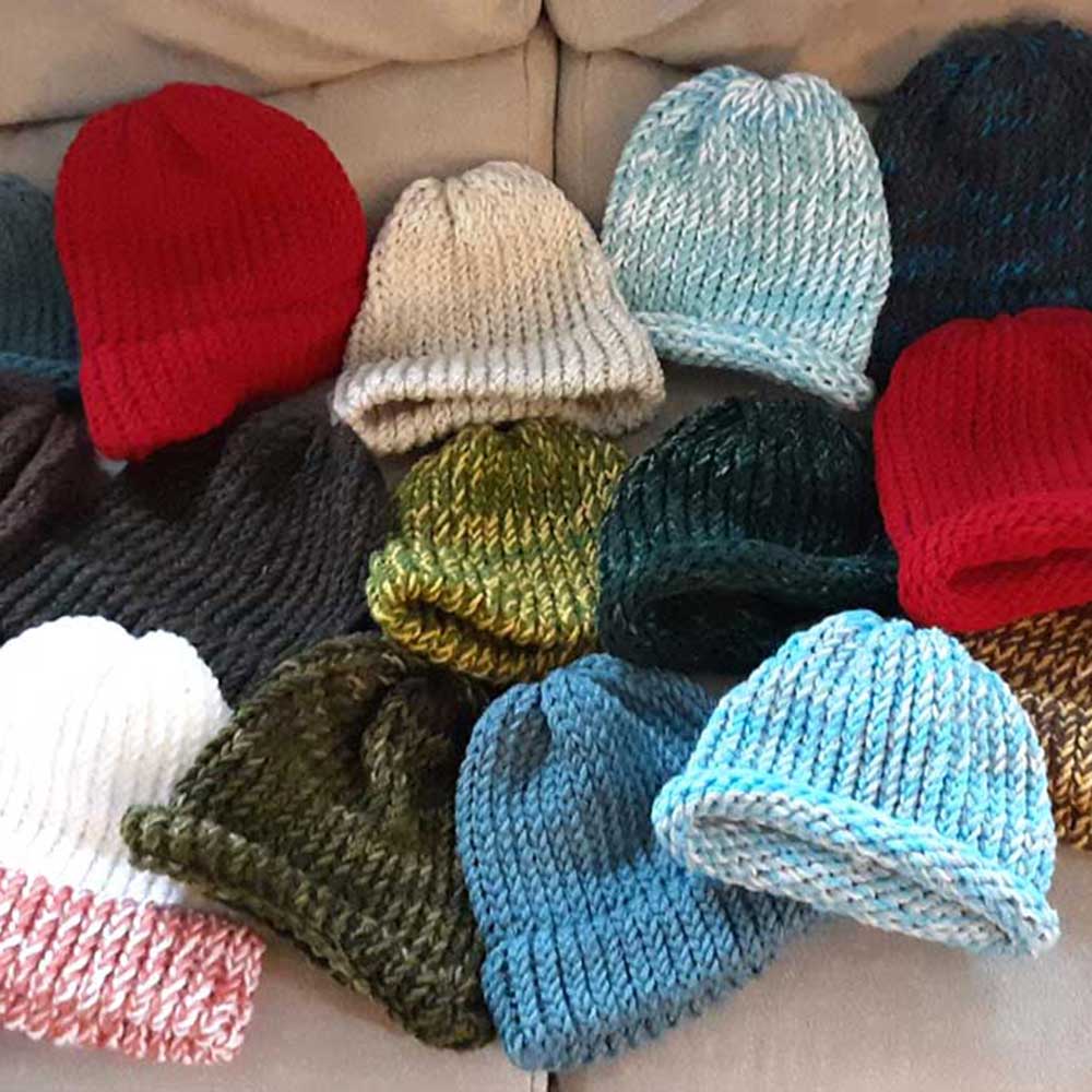 As assortment of hand-knitted hats