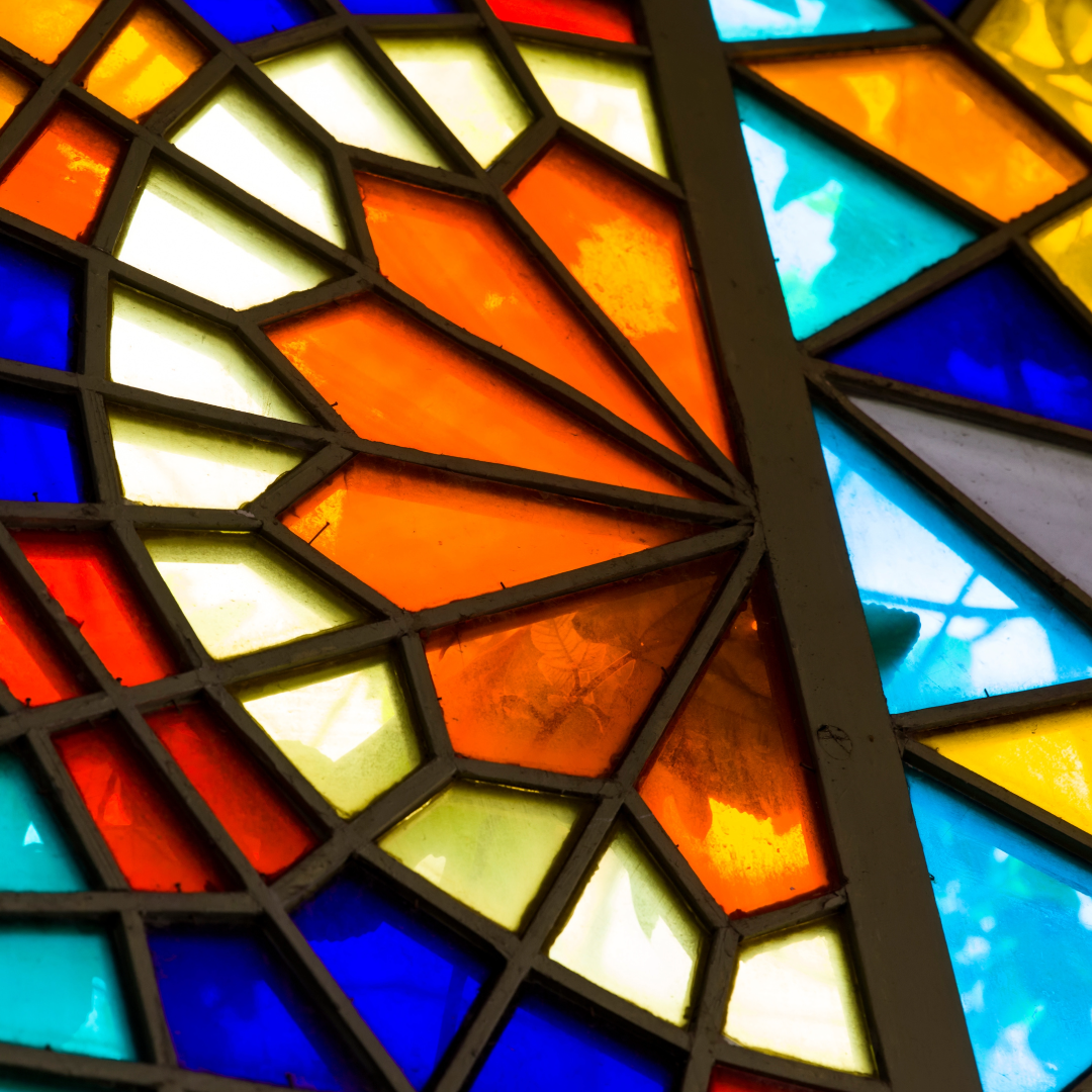The stained glass window of a church